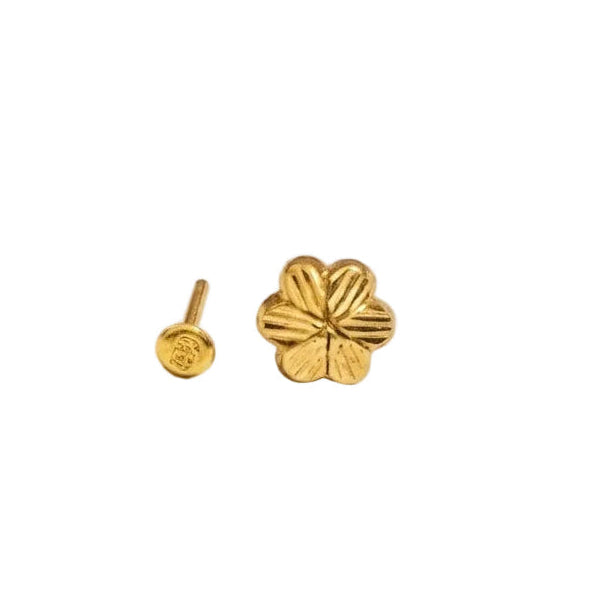 Gold ring with a red gemstone on a white background