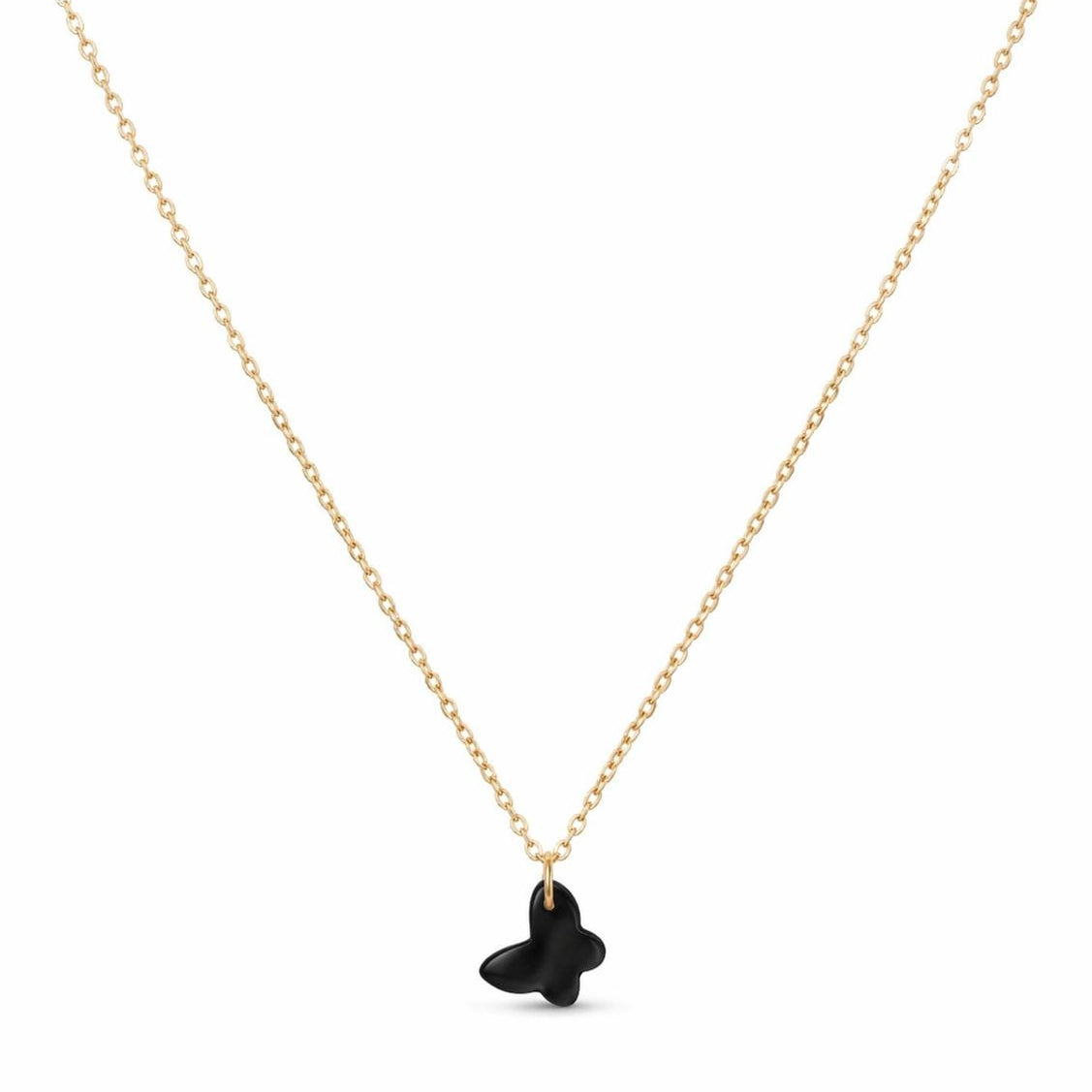 Gold necklace with a black heart pendant on a white background