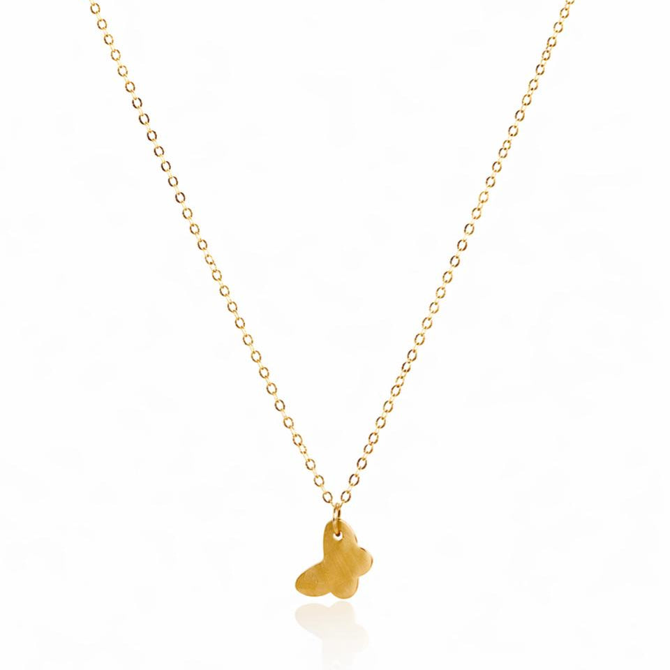 Gold necklace with a small pendant on a white background