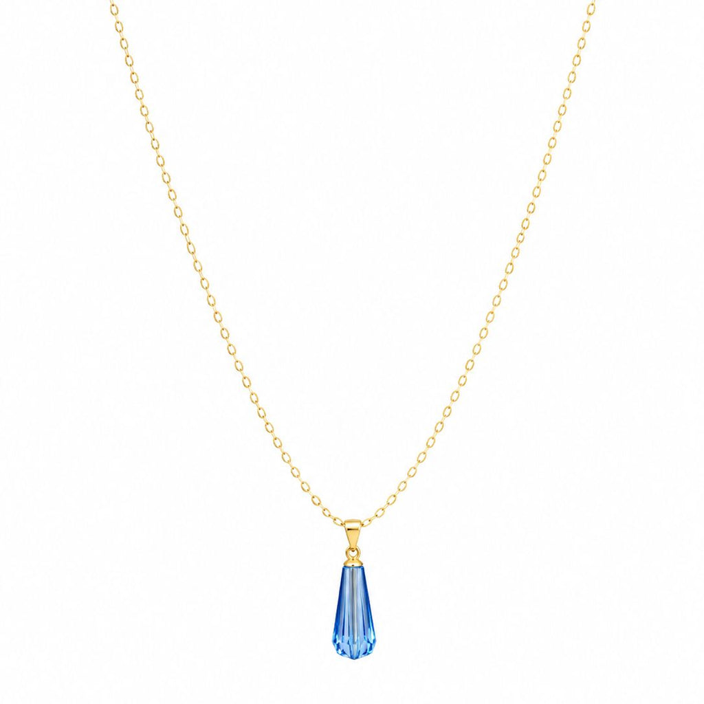 Gold necklace with a blue teardrop pendant on a white background