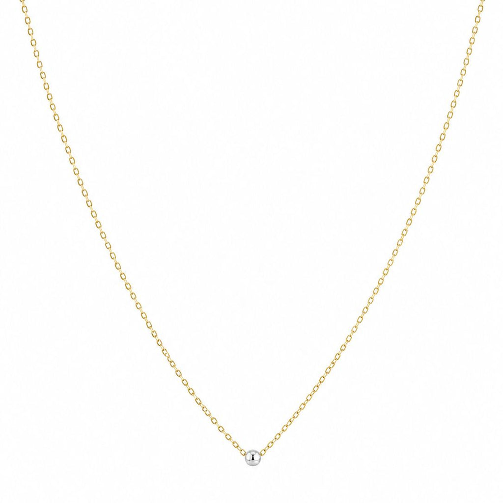 Gold chain necklace on a white background