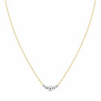 Gold necklace with two silver beads on a white background