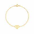 Gold bracelet with a heart-shaped clasp on a white background
