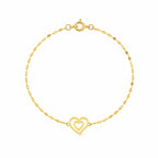 Gold bracelet with a heart-shaped clasp on a white background