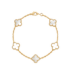 Gold bracelet with white clover-shaped charms on a white background