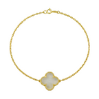 Gold bracelet with a clover-shaped charm on a white background
