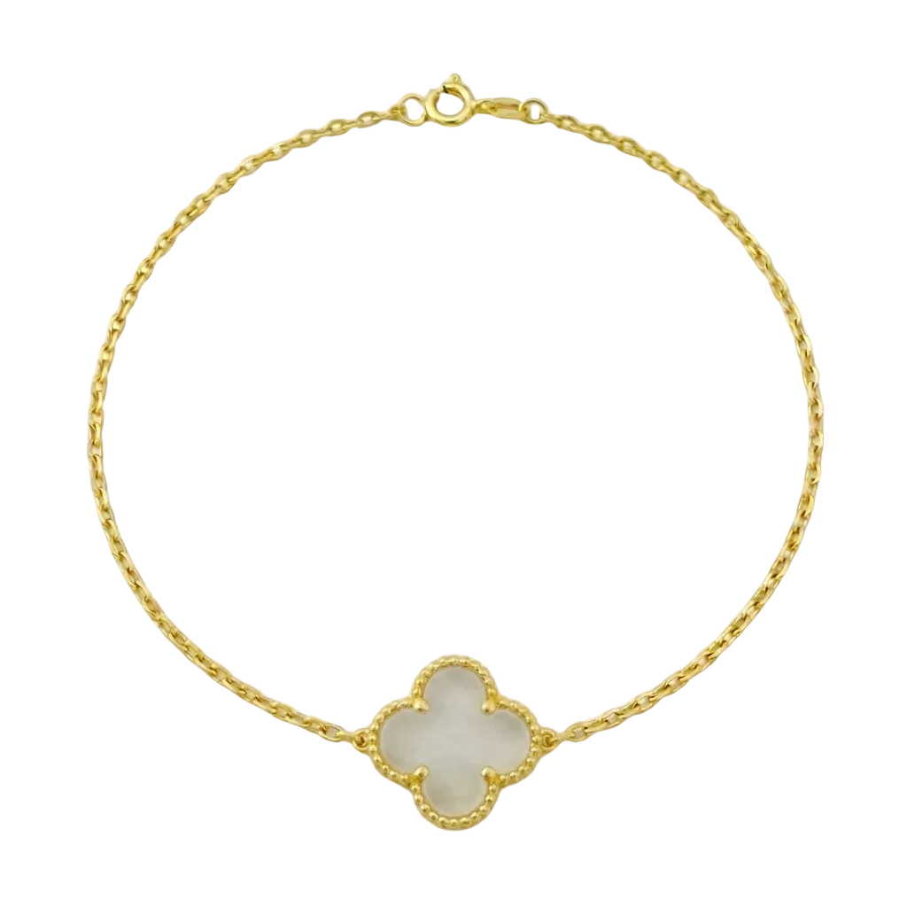 Gold bracelet with a clover-shaped charm on a white background