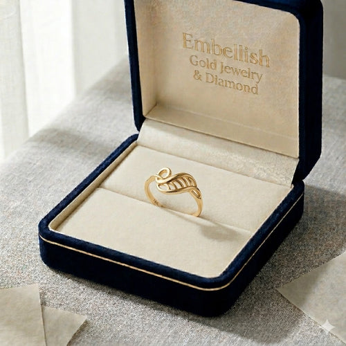 Gold ring in an open jewelry box with 'Embellish Gold Jewelry & Diamond' branding.