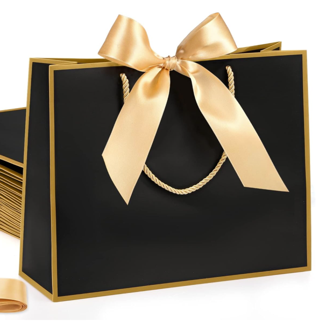 Black gift bag with a gold ribbon on a white background