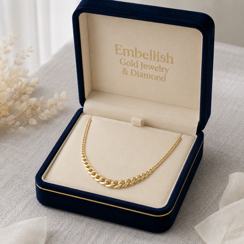 Gold necklace in a 'Embellish Gold Jewelry & Diamond' box on a light surface.