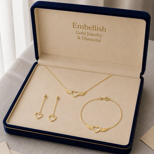 Gold jewelry set including necklace, earrings, and bracelet in an 'Embellish' box.