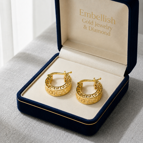 Gold hoop earrings in a 'Embellish Gold Jewelry & Diamond' box on a light gray surface.