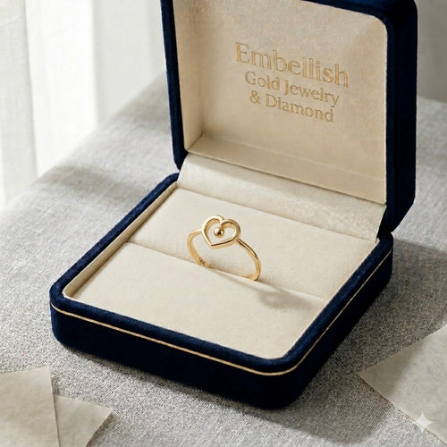 Gold necklace in an open jewelry box with 'Embellish Gold Jewelry & Diamond' branding.