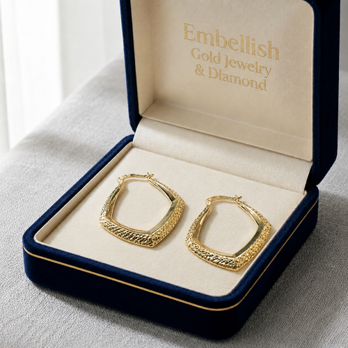 Gold hoop earrings in a 'Embellish Gold Jewelry & Diamond' box on a gray surface.